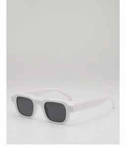 Close-up of white chunky square frame sunglasses with dark lenses and smooth finish
