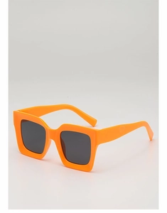 Close-up of vibrant orange thick-frame punk sunglasses with dark gray UV400 lenses