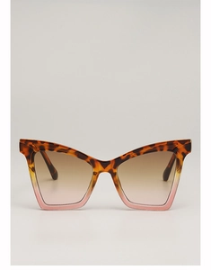 Close-up of cat-eye sunglasses featuring tortoise and translucent pink gradient frames