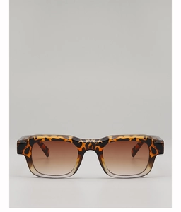 Detail of tortoise square sunglasses with leopard print and brown gradient lenses