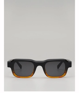 Frontal view of vintage rectangular sunglasses with black to orange gradient frame