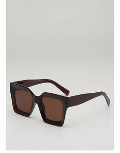 Macro shot of translucent brown acetate frame and tinted lenses of square punk sunglasses