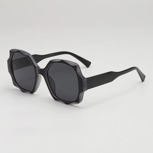 Stylish oversized sunglasses with wavy petal edges and dark grey lenses for UV protection