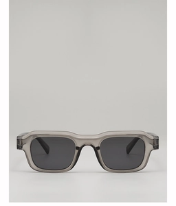 Front detail of rectangle sunglasses with translucent grey frame and dark grey lenses
