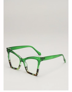Detail view of cat-eye sunglasses featuring transparent green and tortoise frame textures