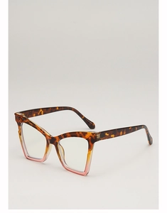 Close-up of cat-eye sunglasses featuring tortoiseshell texture and pink gradient frames