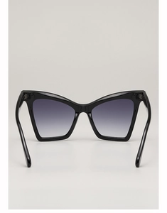 Detailed view of black oversized cat eye sunglasses with grey gradient lenses for women