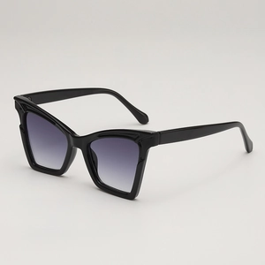 Cat eye oversized sunglasses with black frame and gradient lenses from 45-degree angle