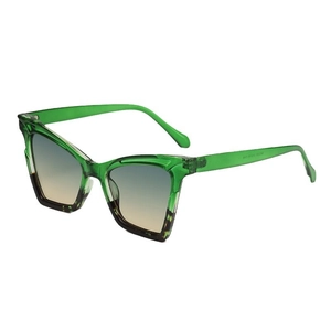 Stylish cat-eye sunglasses with translucent green frames and gradient gray-blue lenses