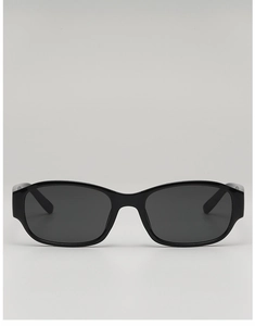 Close-up of retro black square sunglasses with sleek narrow frames and dark gray lenses