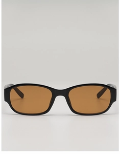Detail of retro narrow rectangle sunglasses featuring black frames and amber lenses