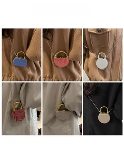 Detailed grid view of mini rhinestone handbag charms with sleek metal handles and chains