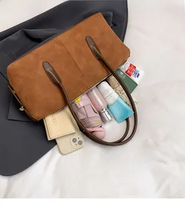 Interior view of brown suede tote bag showing large capacity for umbrella and cosmetics