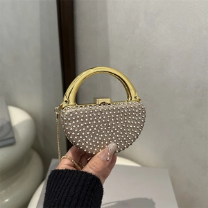 Elegant semi-circle evening bag with shimmering silver rhinestones and gold handle