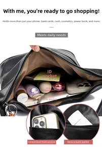 Compartiments internes du sac noir montrant le rangement pour les objets du quotidien