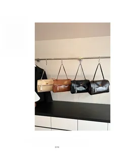 Classic shoulder bags in beige, brown, and black with elegant gold square buckles