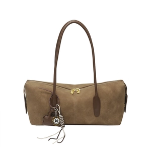 Minimalist khaki suede shoulder bag with dual zipper closure and heart charm