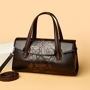 Borsa a mano in pelle marrone scuro con motivi floreali a rilievo e texture lucertola