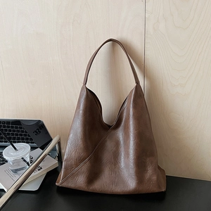Large dark brown leather hobo bag for women with minimalist patchwork and soft texture