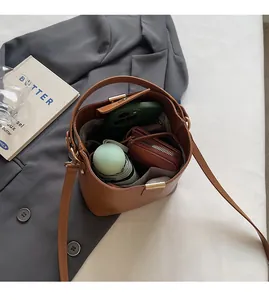 Top-down view of a brown leather bucket bag showing spacious interior for daily essentials