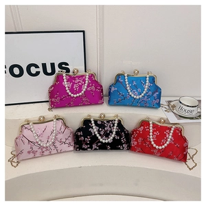 Five assorted retro silk party bags with floral patterns and pearl chain handles