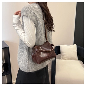 Brown glossy leather underarm bag with Fashion lettering and adjustable strap