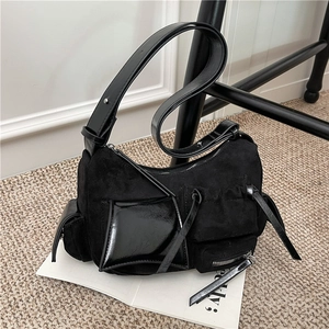 Chic black utility shoulder bag with multi-pocket patchwork and edgy silver hardware