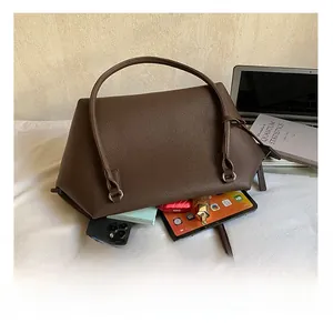 Detail showing the large interior capacity of this dark brown pebbled leather tote bag