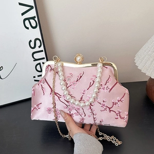 Pink satin evening bag with cherry blossom embroidery and pearl chain handle