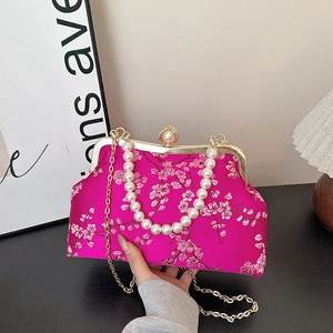 Elegant rose red silk clutch with floral embroidery and decorative pearl handle