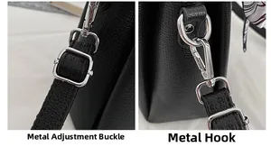 Close-up of adjustable silver buckle and swivel hook on black pebble leather bag