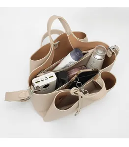 Top view of bucket bag interior showing spacious compartments and pebble leather texture