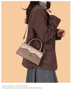 Side view of a vintage dark brown box bag with a golden square lock and slim shoulder strap