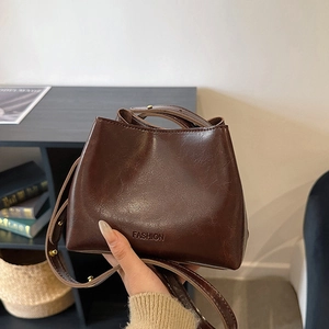 Chic dark brown vintage bucket bag in oily faux leather with fashion letter embossing
