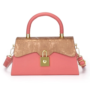 Pink leather handbag with metallic bronze textured flap and gold buckle on white background