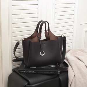 Deep brown lychee pattern leather bucket bag with top handles and silver charm