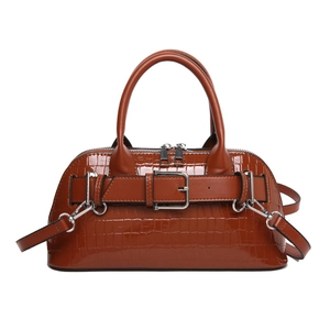 Caramel crocodile-embossed leather top handle shell bag with belt buckle and crossbody strap