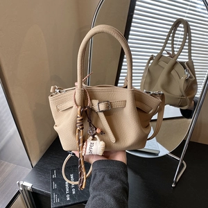 Beige lychee pattern leather handbag with crossbody strap and coffee tag charm