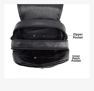 Detail of black pebbled leather backpack with multiple zipper compartments and inner pockets