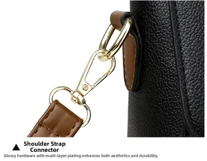 Detail of lobster clasp and shoulder strap connection on litchi grain leather bag
