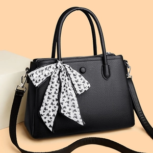 Chic black litchi pattern handbag for women with a silk scarf detail and shoulder strap