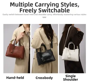 Embossed leather tote bag shown in tote, crossbody, and shoulder styles with gold hardware