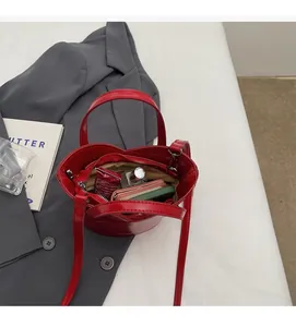 Macro shot of red heart-shaped bag interior with functional zipper pockets and dividers