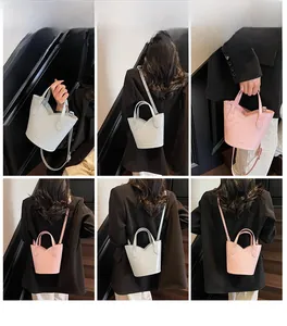 Multiple views of gray and pink bucket bags showing crossbody and shoulder styling