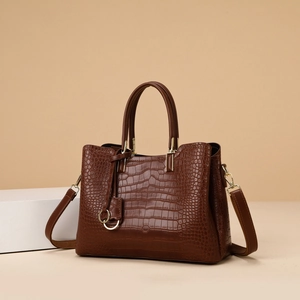 Classic dark brown crocodile embossed tote bag with gold ring pendant and shoulder strap