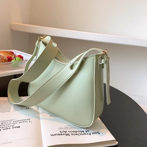 Minimalist mint green hobo shoulder bag with wide strap and gold metal hardware detail
