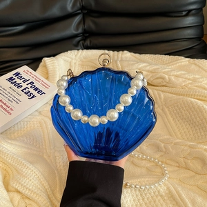 Blue semi-transparent shell-shaped acrylic bag with pearl handle and chain strap