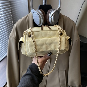 Light yellow quilted chain bag with multiple pockets and golden leather-threaded strap