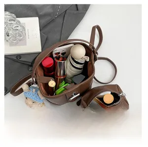 Interior view of brown pebble leather bucket bag showing large storage capacity for essentials