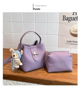 Detail of lavender lychee grain bucket bag set with silver clasp and cute bear pendant